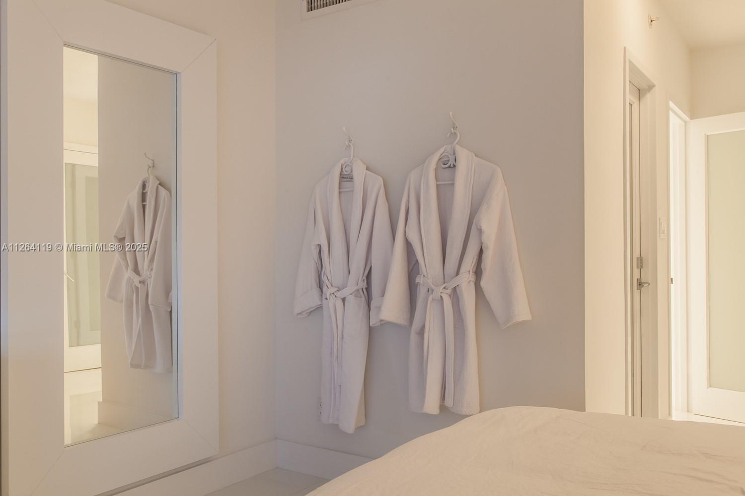 100 Lincoln Road, Unit 943 Miami Beach, FL 33139 - Photo 14 of 56 a bedroom with a bed and a window