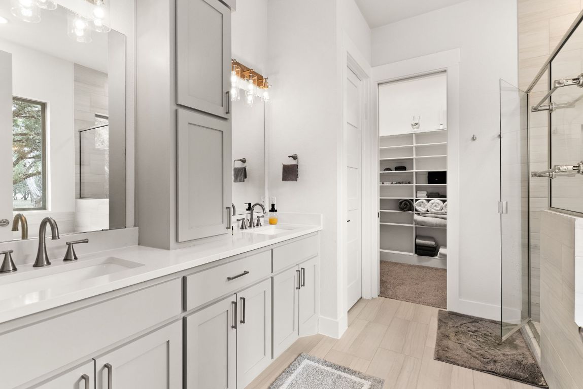 2140 Carpenter Loop Burnet, TX 78611 - Photo 17 of 40 a bathroom with a sink and a mirror