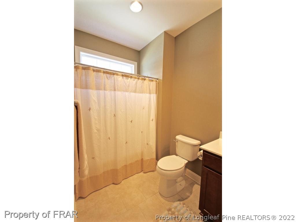 309 Duncan Road Southern Pines, NC 28387 - Photo 6 of 36 a bathroom with a toilet and a shower