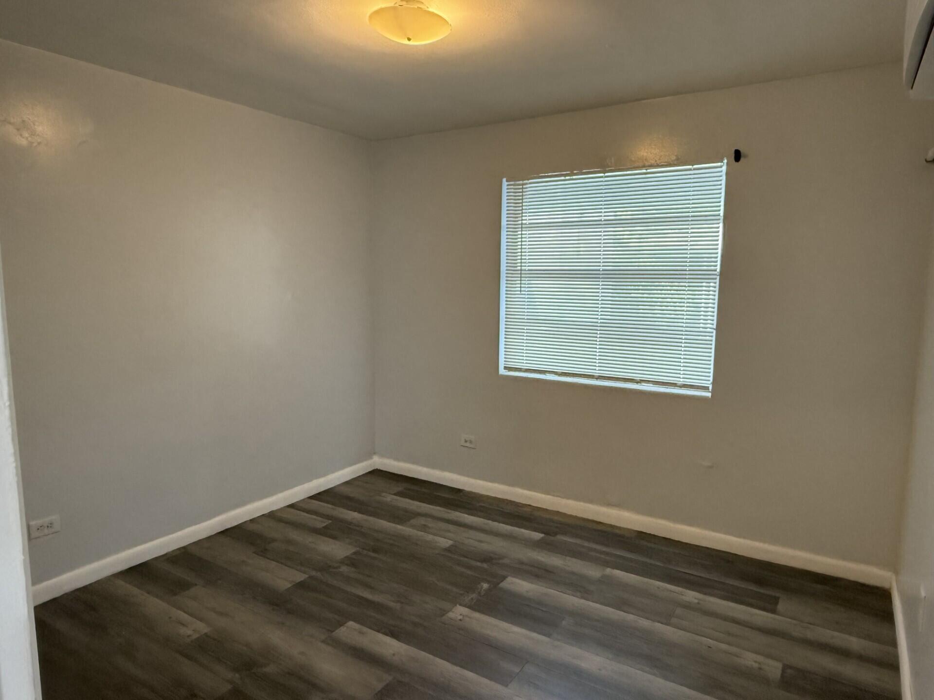 131 East 27th Street, Unit 1 Riviera Beach, FL 33404 - Photo 4 of 10 an empty room with a window