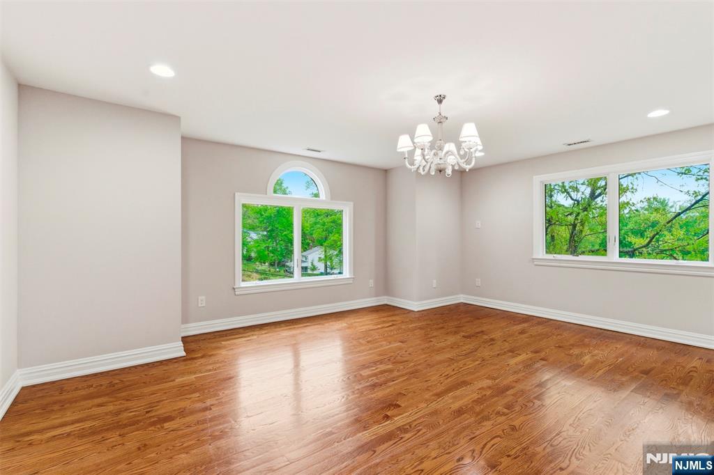 767 Orangeburgh Road River Vale, NJ 07675 - Photo 24 of 49 a view of an empty room with wooden floor and a window