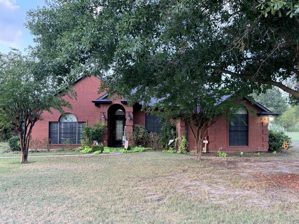 313 An County Road, Unit 2145 Palestine, TX 75801 - Photo 1 of 40 Red brick exterior with a dark roof and a covered entry