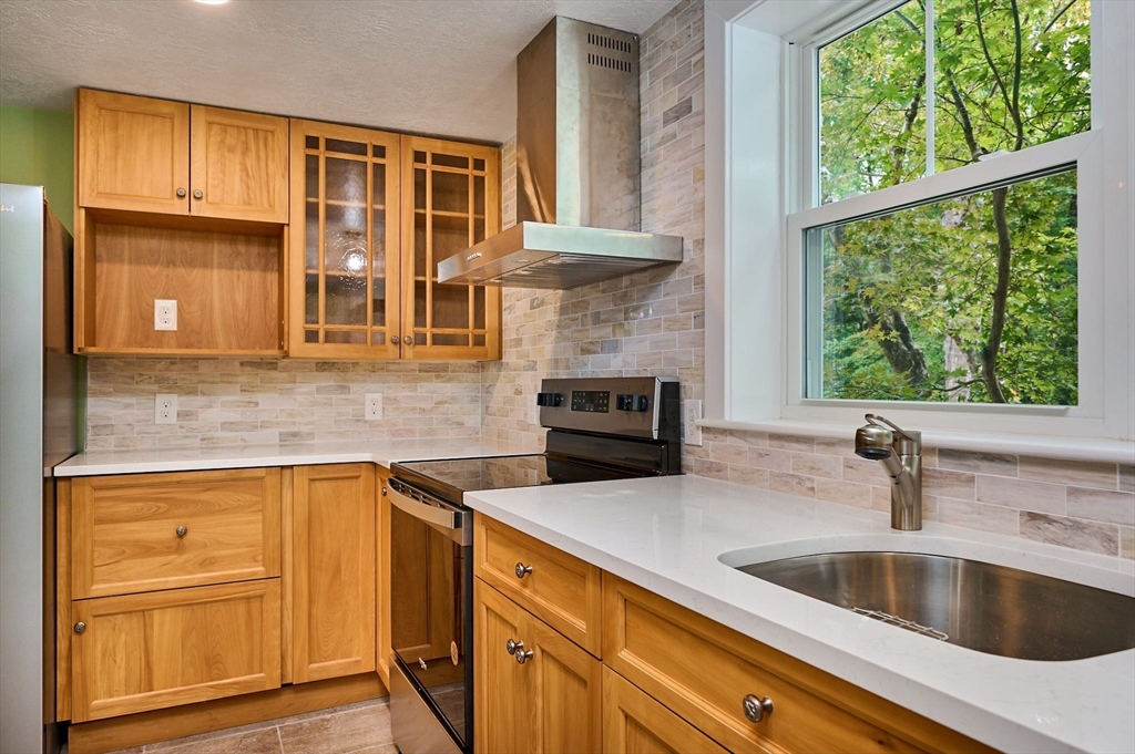 74 Lead Mine Road Southampton, MA 01073 - Photo 6 of 34 a kitchen with a sink and a refrigerator