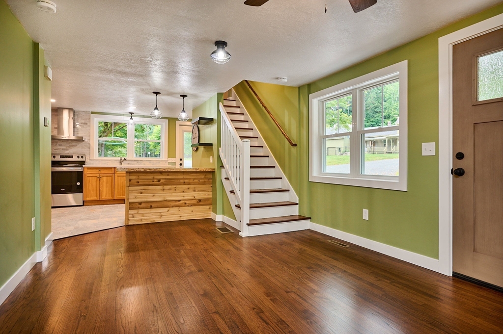 74 Lead Mine Road Southampton, MA 01073 - Photo 9 of 34 a view of a room with wooden floors and stairs