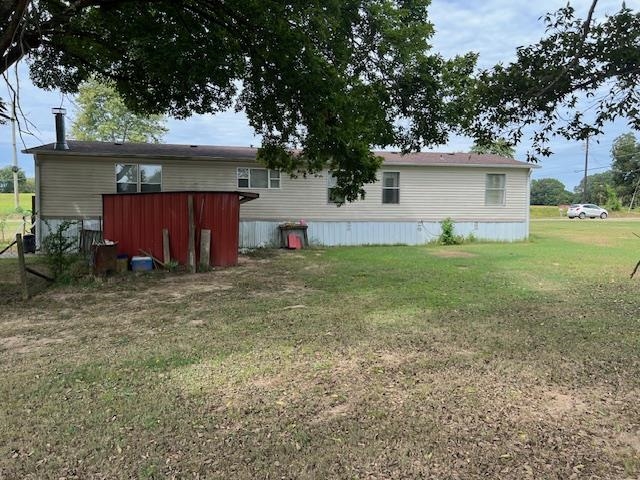 38 Bud Jennings Road Henning, TN 38041 - Photo 14 of 14 a view of a house with a yard and tree