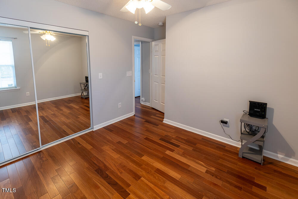 5420 Golden Moss Trail Raleigh, NC 27613 - Photo 19 of 33 a view of a room with wooden floor