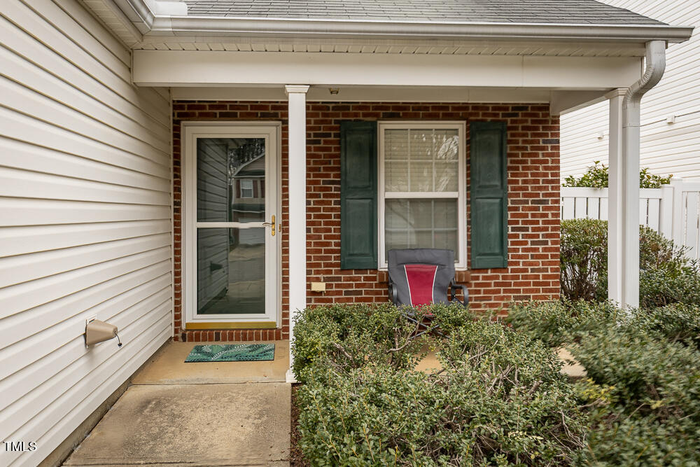 5420 Golden Moss Trail Raleigh, NC 27613 - Photo 2 of 33 a front view of a house with a yard and garage
