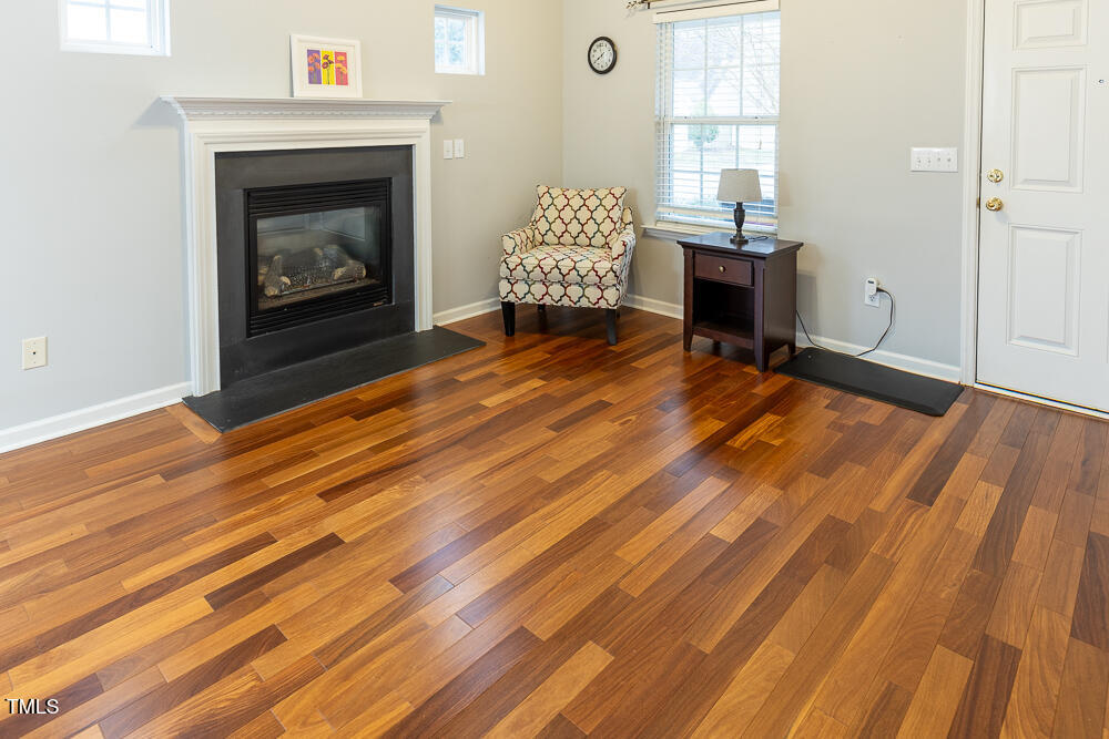 5420 Golden Moss Trail Raleigh, NC 27613 - Photo 4 of 33 a living room with a bed furniture and a fireplace