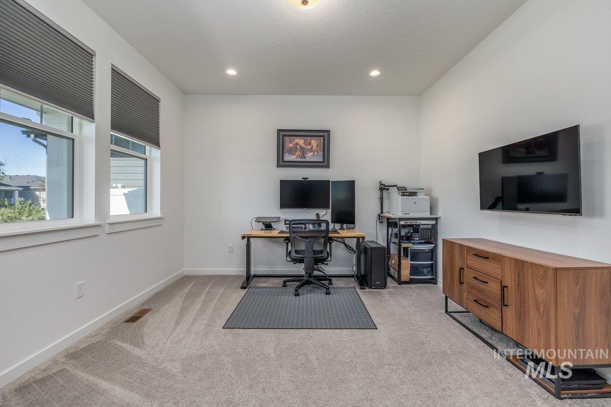 1380 West Chilitna Street Meridian, ID 83642 - Photo 36 of 50 Carpeted room featuring two large windows with horizontal blinds, recessed lighting, and white baseboards