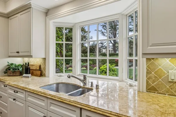 a view of a sink and a window