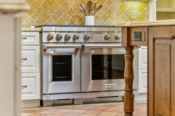 a kitchen with a stove and a microwave