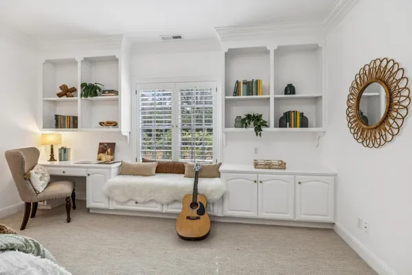 a bedroom with furniture and a window