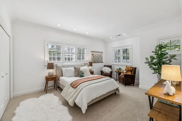 a bedroom with a bed and window