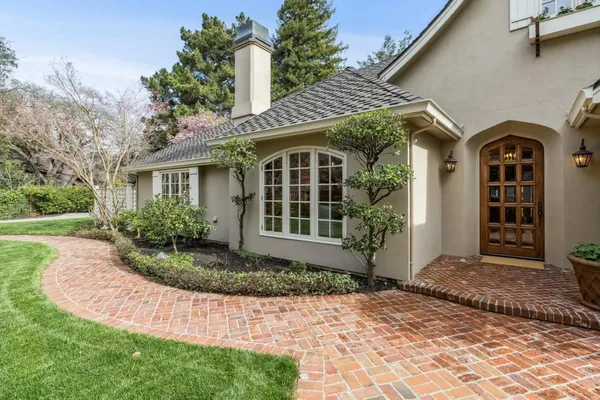 a front view of a house with garden
