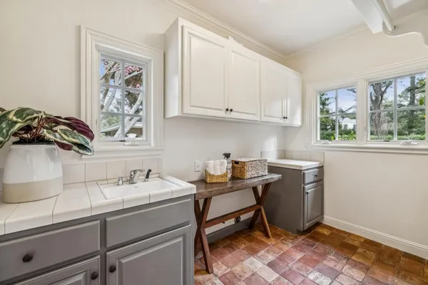 a room with a cabinets and window
