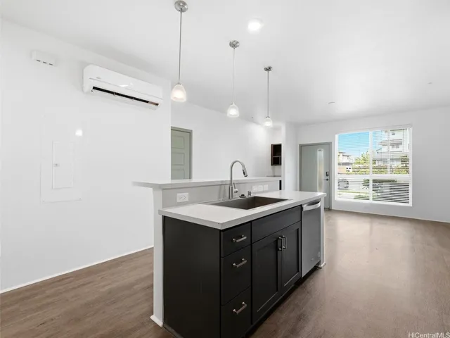 a kitchen with a sink and stove