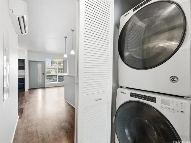 a view of a hallway with washer and dryer