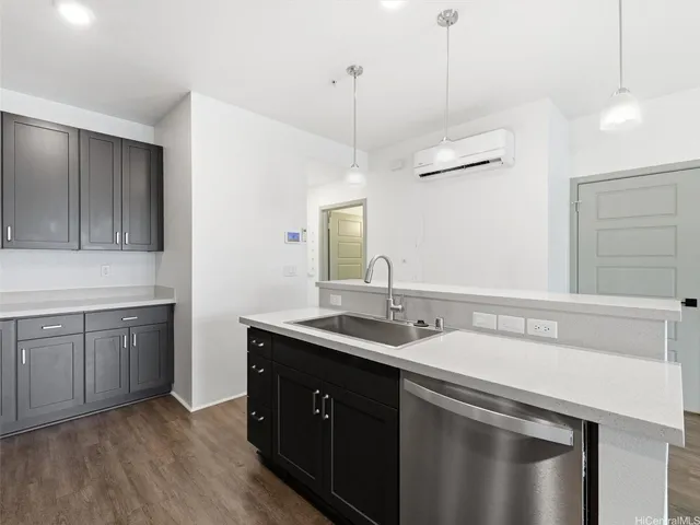 a kitchen with sink stove and cabinets
