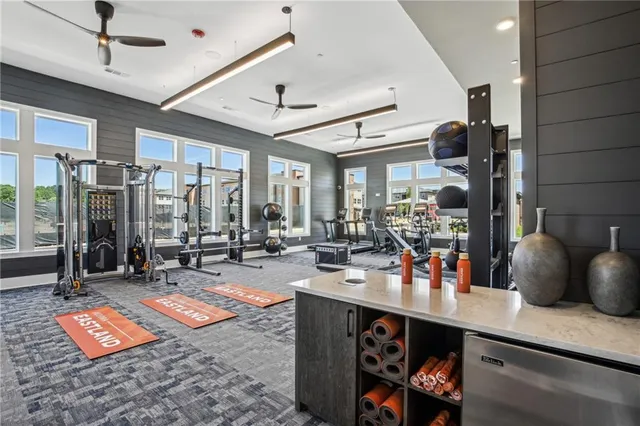 a room with gym equipment and a large window