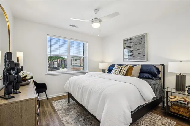 a bed room with a bed and a window