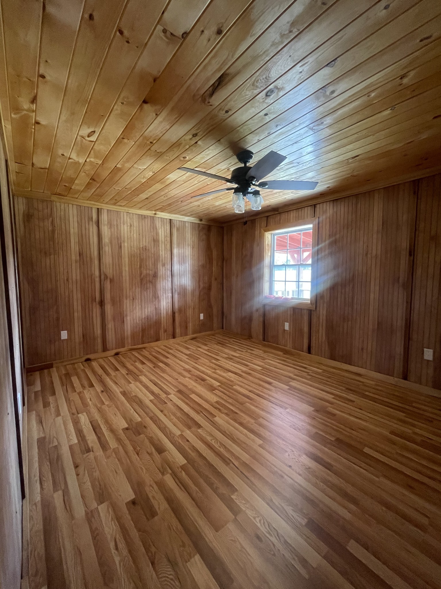 3141 Oak Grove Road Red Boiling Springs, TN 37150 - Photo 10 of 14 a view of an empty room with window and wooden floor