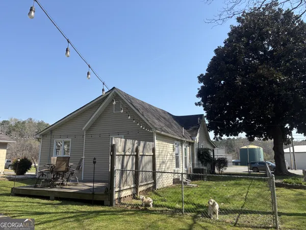 a view of a swimming pool with a yard