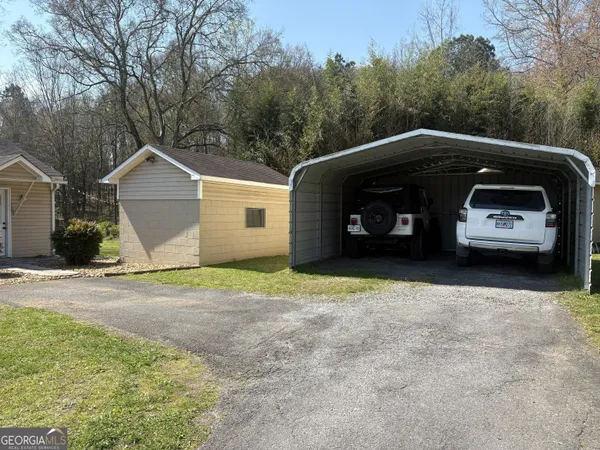a kitchen with stainless steel appliances a refrigerator sink and cabinets