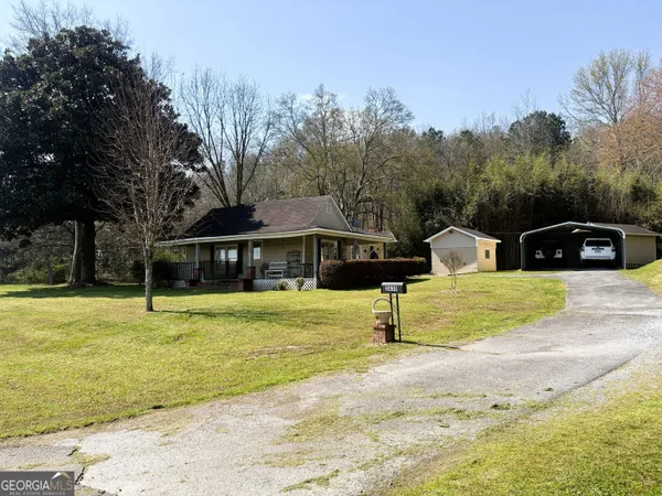 a front view of a house with swimming pool