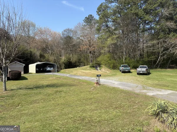 a house view with a play ground in front of it