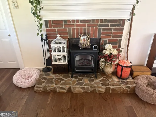a view of a room with wooden floor