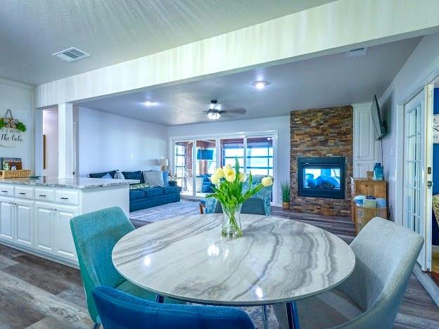 1017 Airport Road Graford, TX 76449 - Photo 13 of 32 a dining room with furniture potted plants and wooden floor