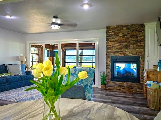 1017 Airport Road Graford, TX 76449 - Photo 14 of 32 a living room with furniture chandelier and a fireplace