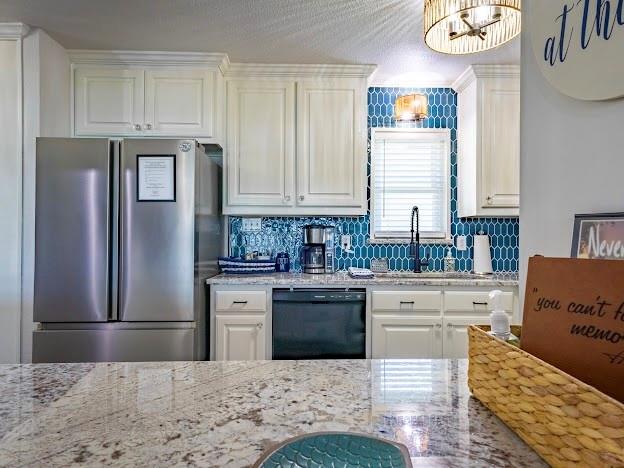 1017 Airport Road Graford, TX 76449 - Photo 16 of 32 a kitchen with stainless steel appliances kitchen island granite countertop a refrigerator and a stove top oven
