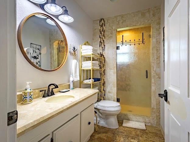 1017 Airport Road Graford, TX 76449 - Photo 24 of 32 a bathroom with a toilet sink and mirror