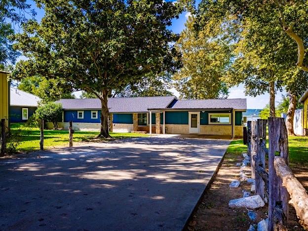 1017 Airport Road Graford, TX 76449 - Photo 26 of 32 a view of a house with a yard