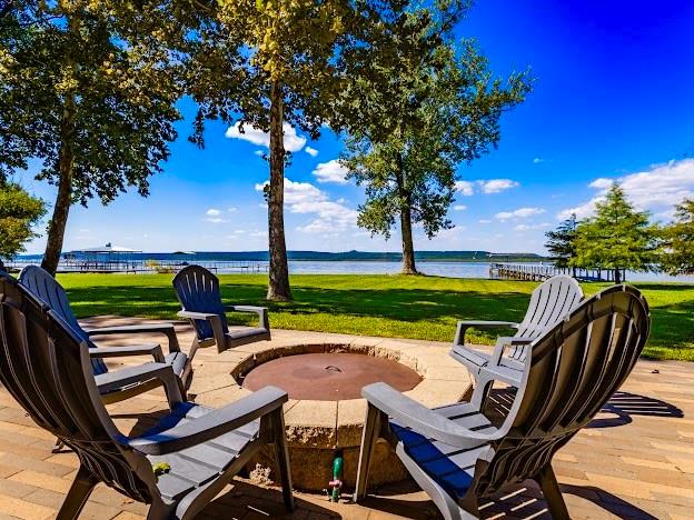 1017 Airport Road Graford, TX 76449 - Photo 4 of 32 an outdoor sitting area with chairs and a table