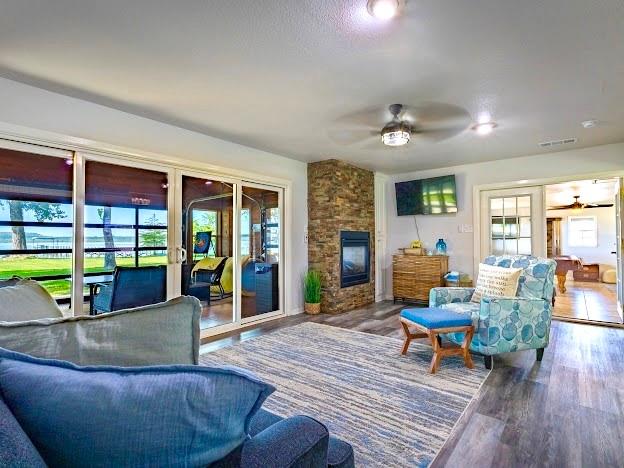 1017 Airport Road Graford, TX 76449 - Photo 10 of 32 a living room with furniture and a fireplace