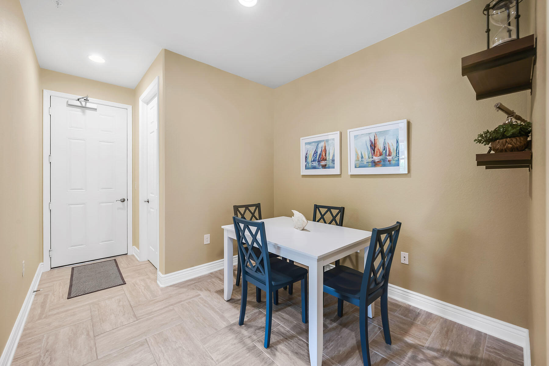 9066 Albion Lane North, Unit 5101 Naples, FL 34113 - Photo 25 of 48 a view of a dining room with furniture