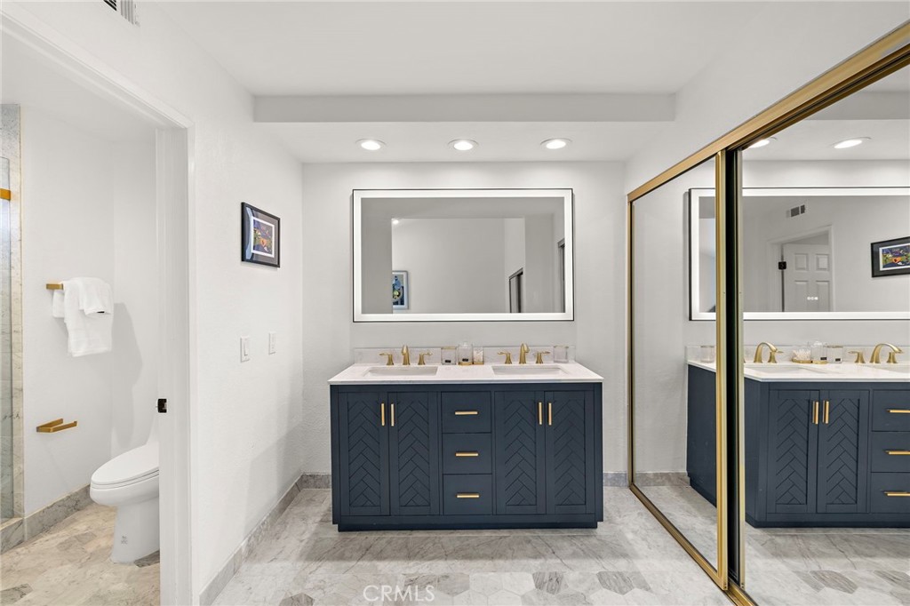 522 Calle Cuadra San Clemente, CA 92673 - Photo 22 of 37 a bathroom with a granite countertop sink toilet and shower