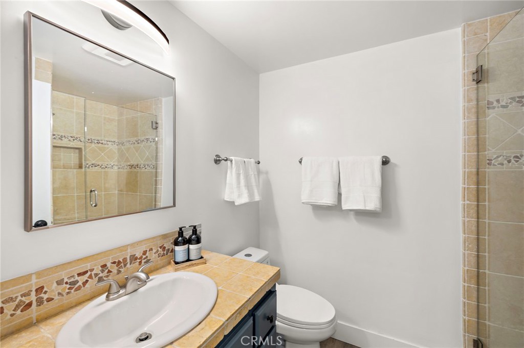 522 Calle Cuadra San Clemente, CA 92673 - Photo 27 of 37 a bathroom with a sink toilet and shower