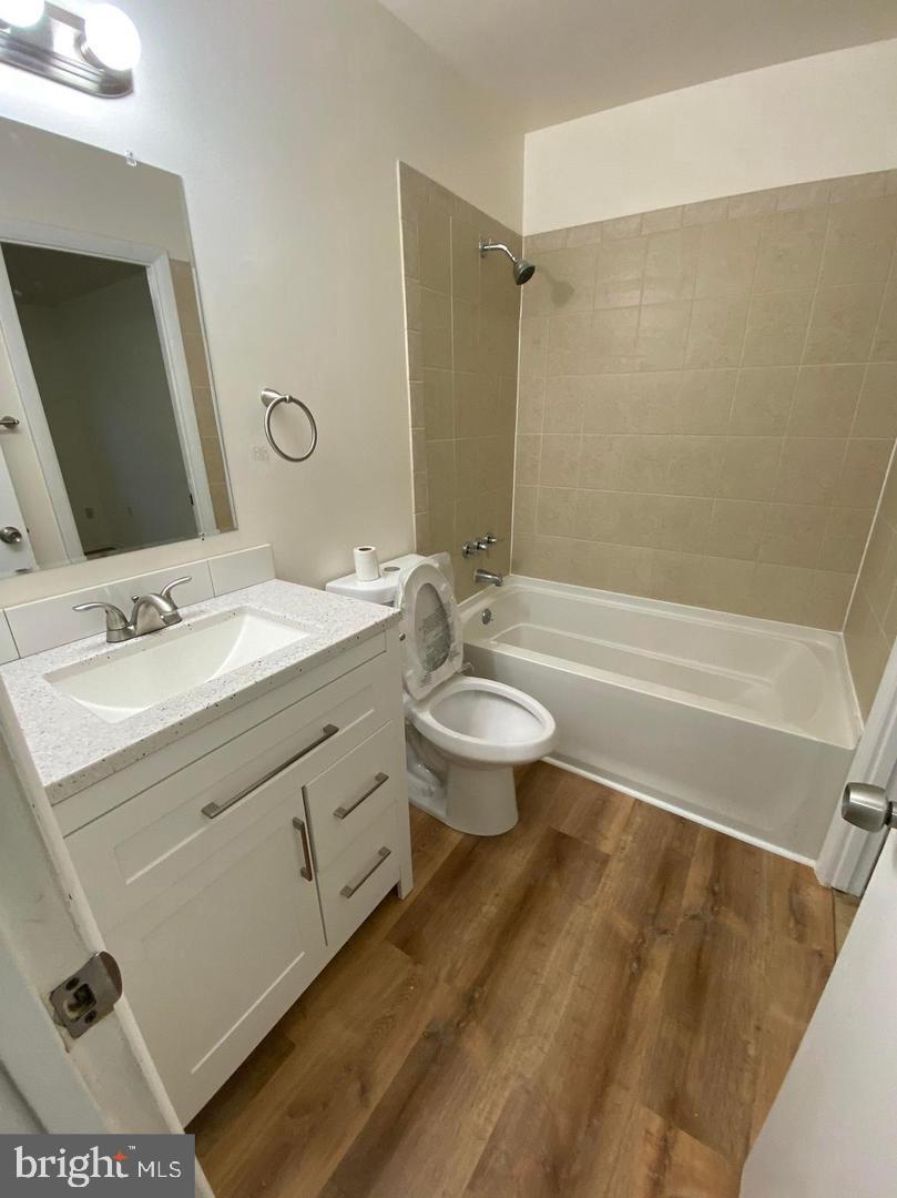 14 Vienna Court Frederick, MD 21702 - Photo 7 of 9 a bathroom with a double vanity sink toilet mirror and bathtub