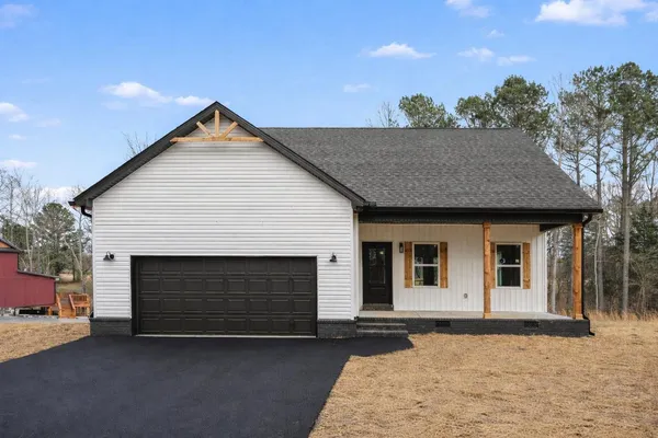 a front view of a house with a garage