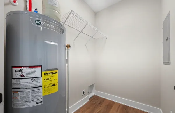 a view of storage and utility room with a fireplace