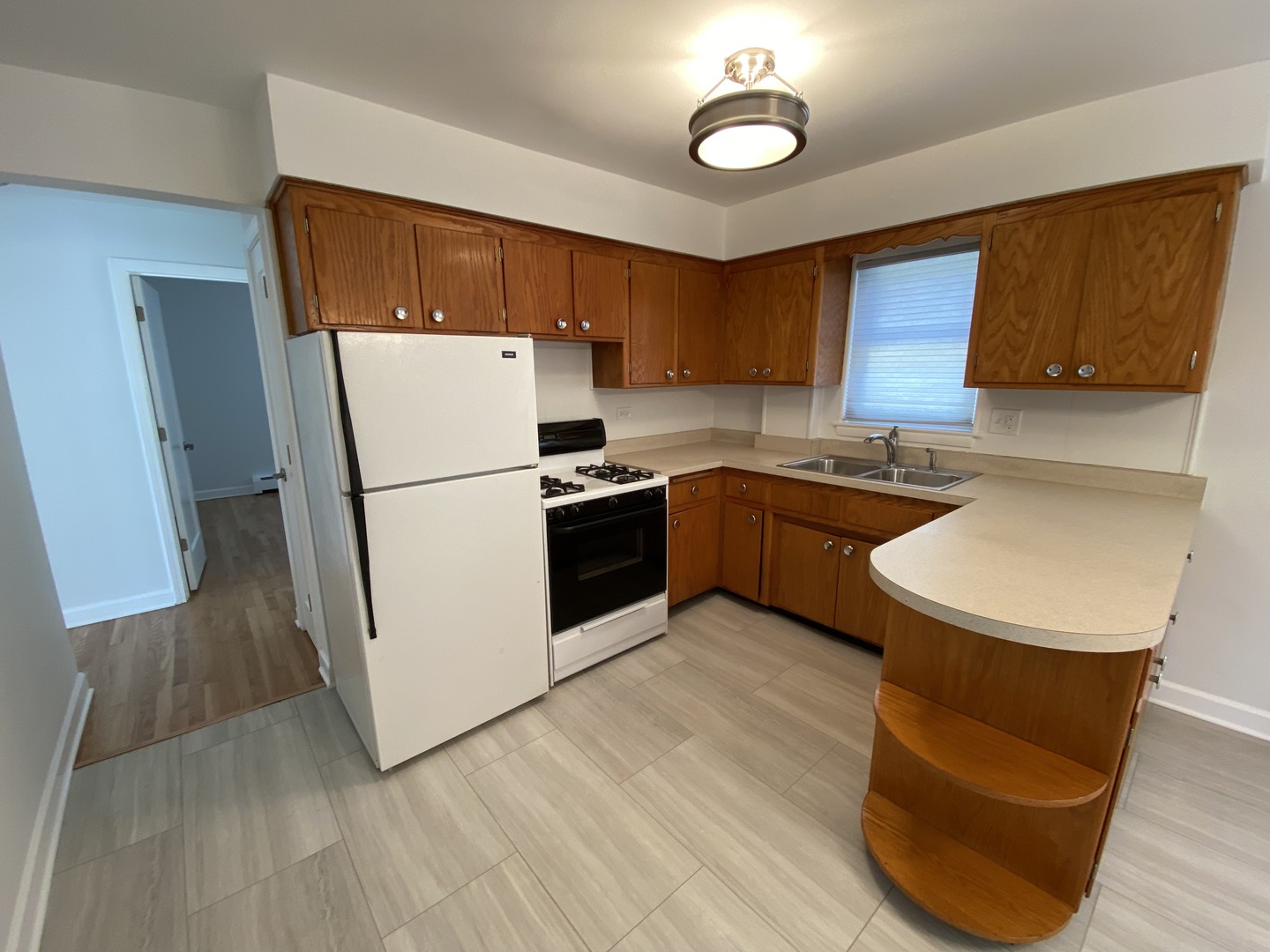 3146 Ridgeland Avenue, Unit 3W Berwyn, IL 60402 - Photo 13 of 16 a kitchen with stainless steel appliances granite countertop a sink stove and refrigerator