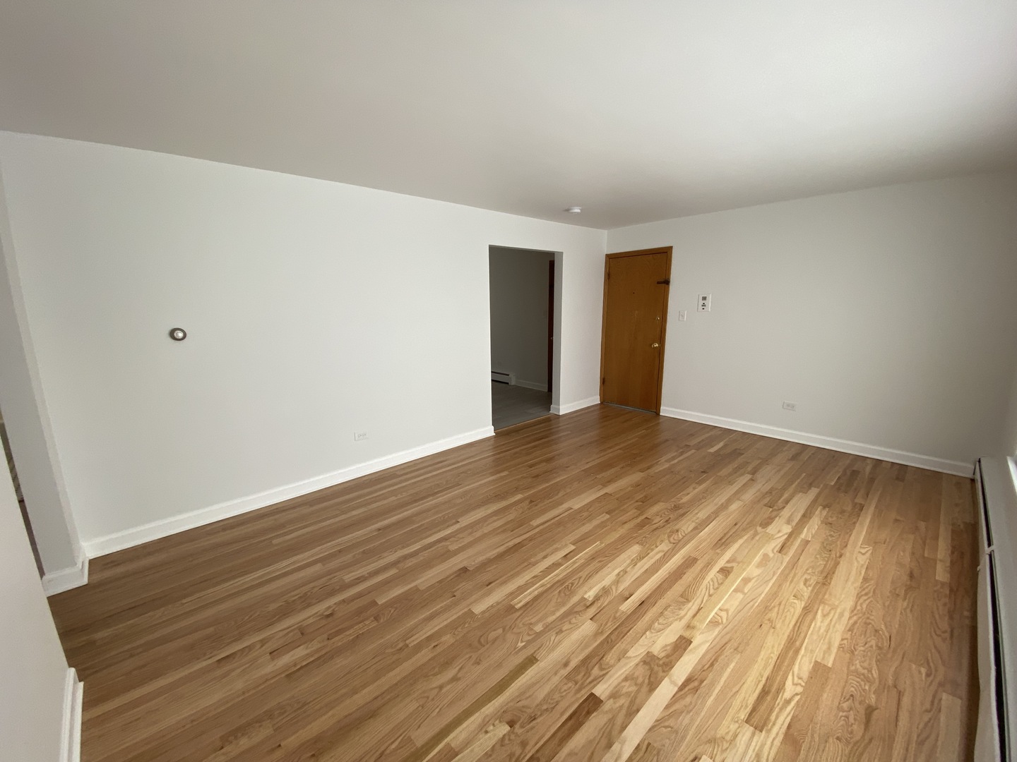 3146 Ridgeland Avenue, Unit 3W Berwyn, IL 60402 - Photo 4 of 16 a view of an empty room with wooden floor