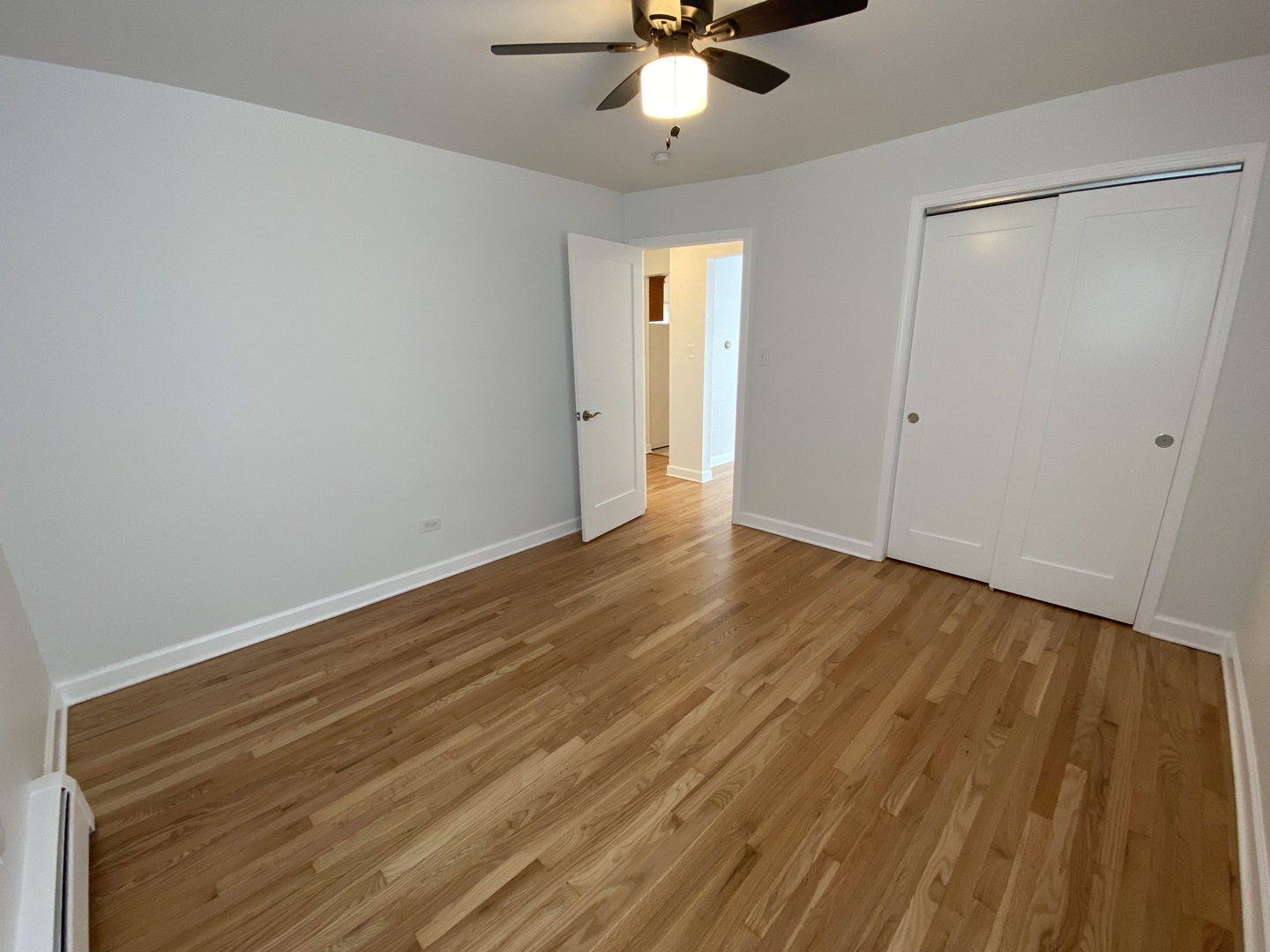 3146 Ridgeland Avenue, Unit 3W Berwyn, IL 60402 - Photo 6 of 16 a view of an empty room with wooden floor