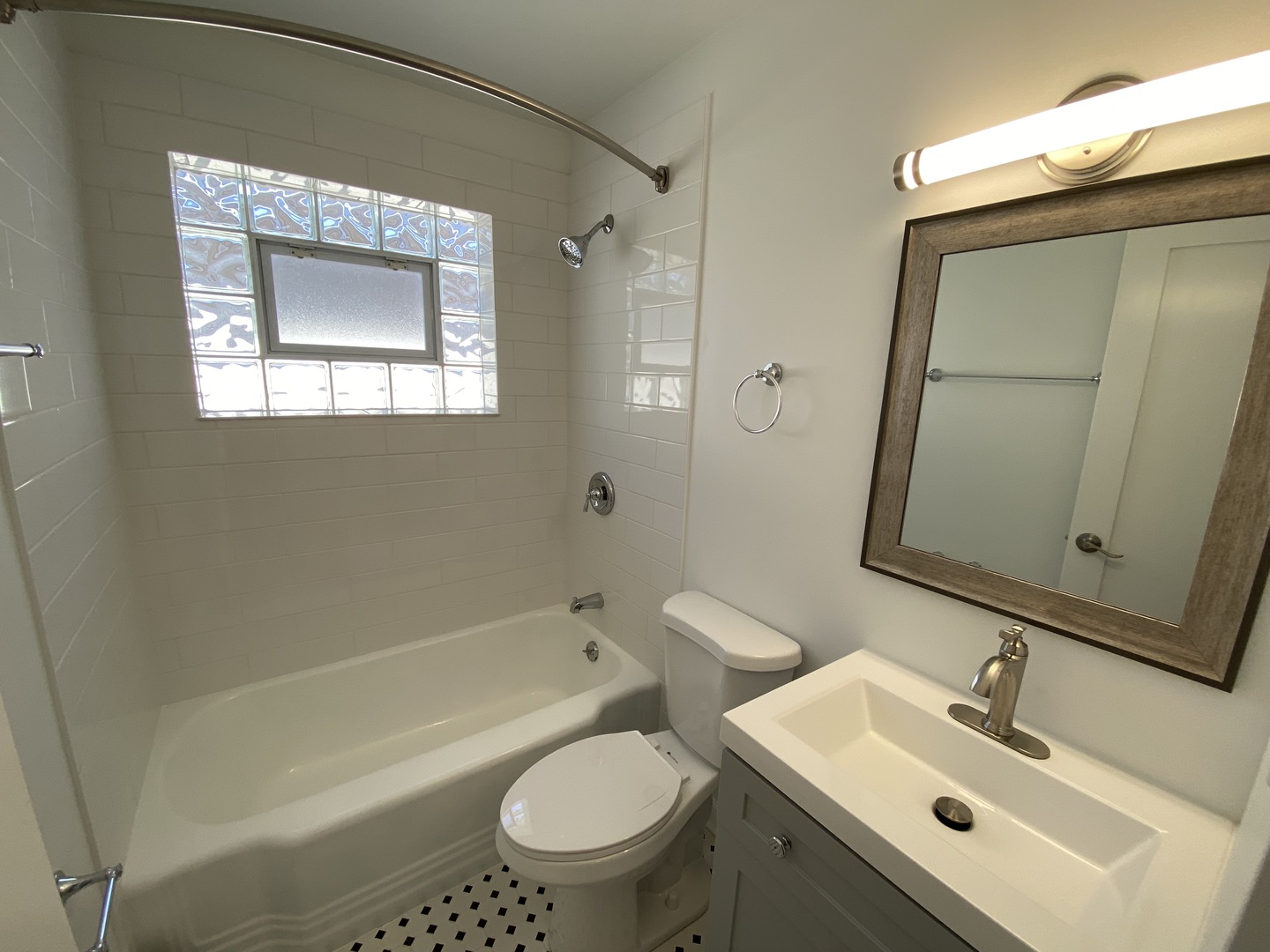 3146 Ridgeland Avenue, Unit 3W Berwyn, IL 60402 - Photo 9 of 16 a bathroom with a sink toilet and shower