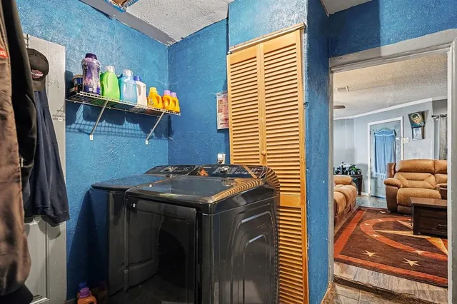 a utility room with dryer and washer