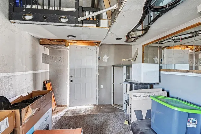 a storage and utility room with a sink