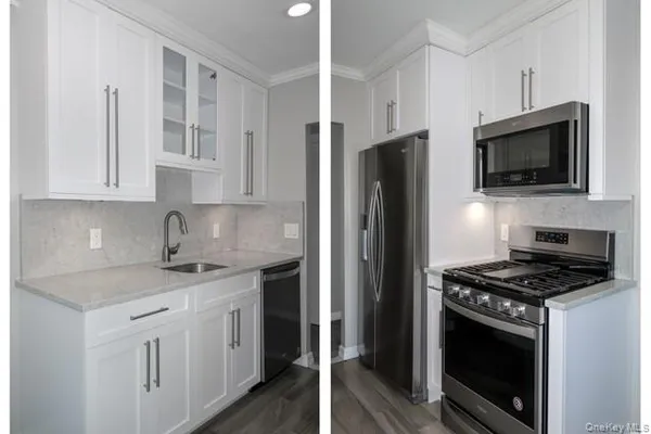 a kitchen with stainless steel appliances granite countertop white cabinets granite counter tops and a stove